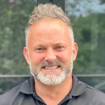 Richard smiling directly at the camera.